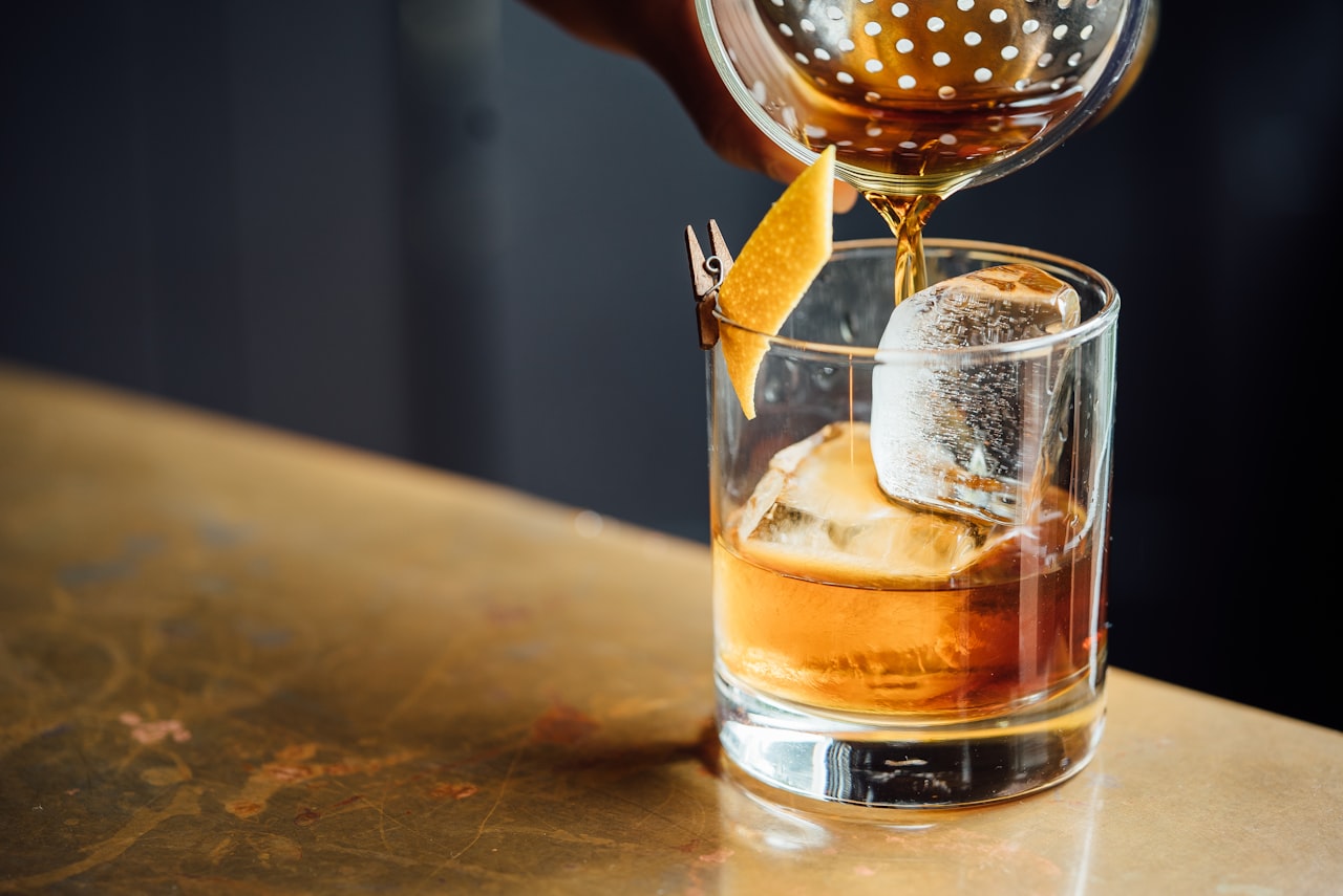 A cocktail in a glass on a bar