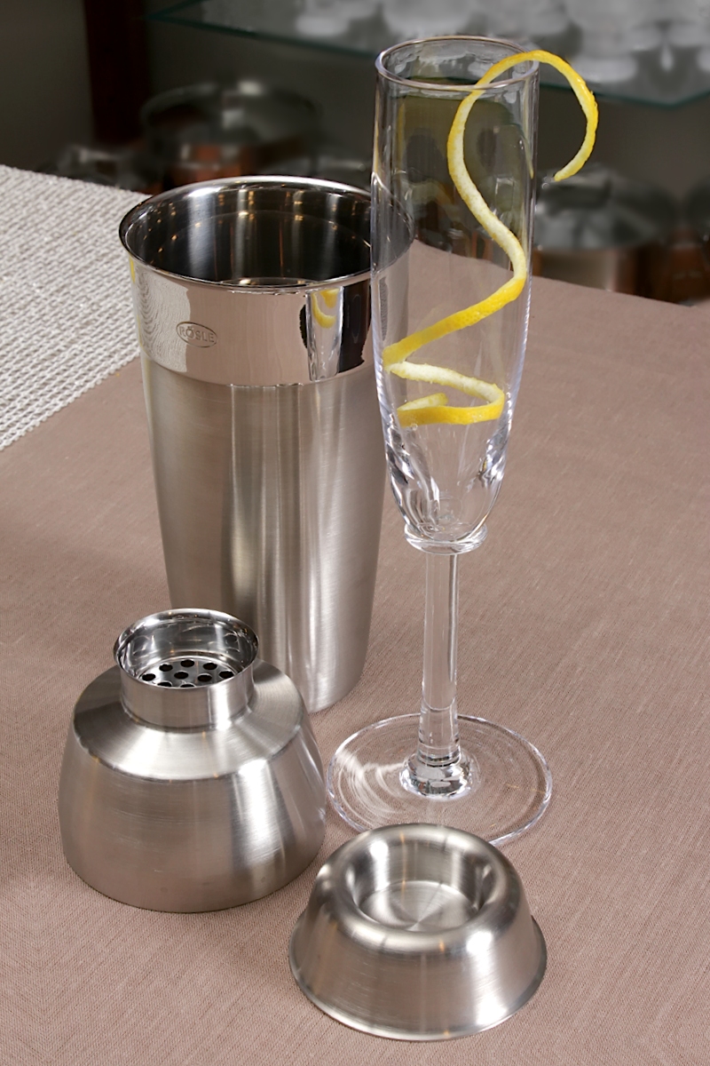A cocktail shaker on a bar